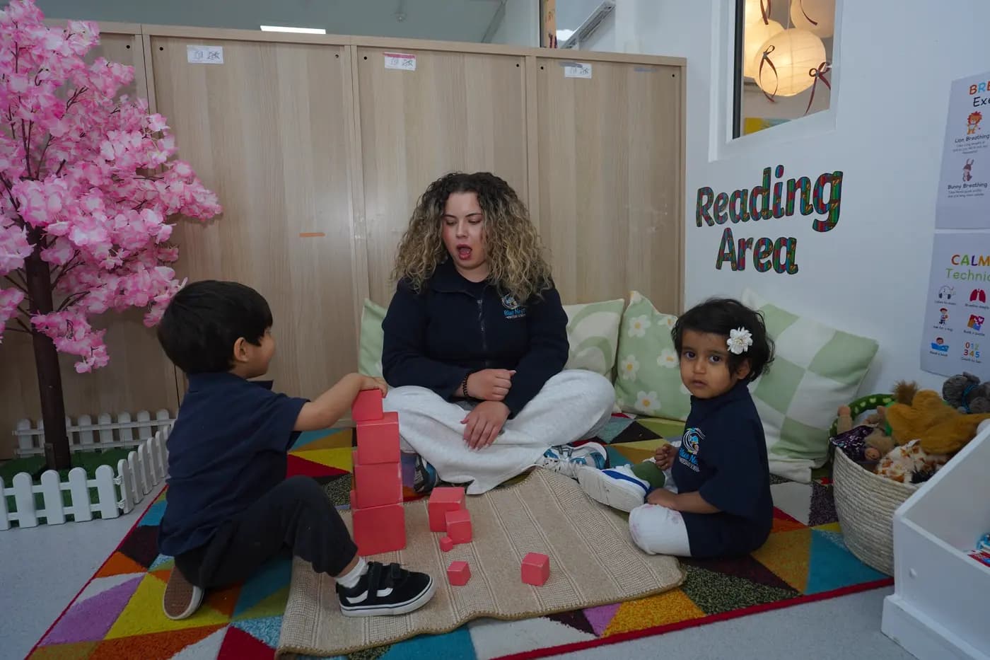 Children learning in the classroom at Blue Nest Montessori Borehamwood