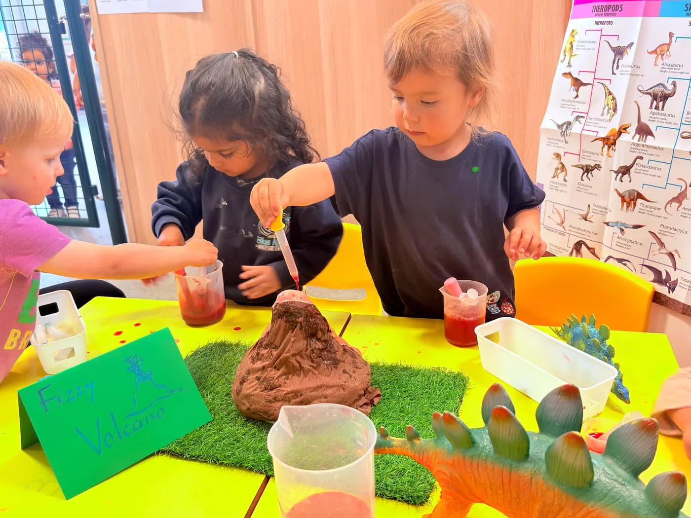 Children exploring a hands-on science experiment at Blue Nest Montessori Harrow