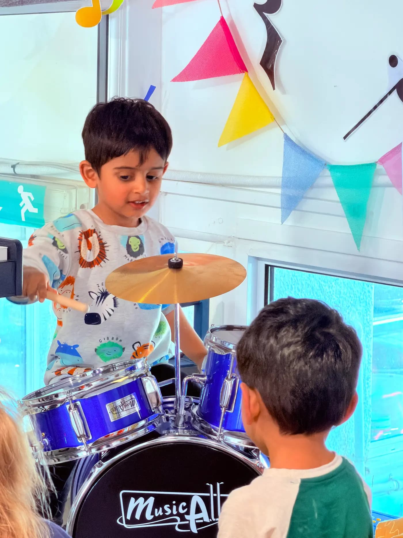 Child enjoying a music activity at Blue Nest Montessori Harrow
