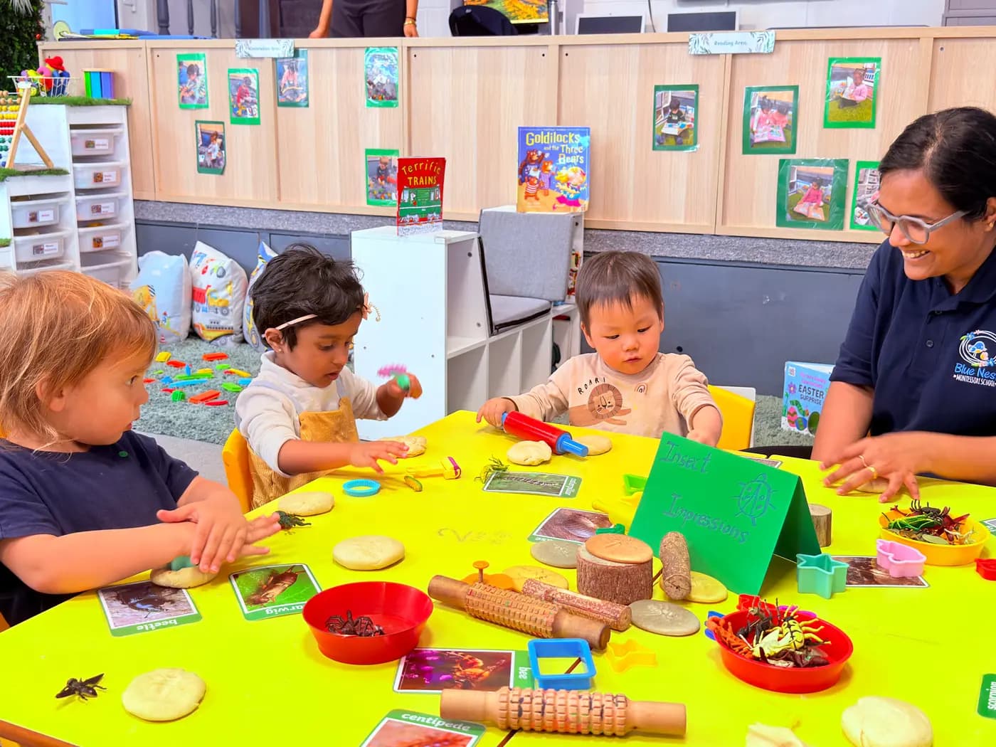 Toddler concentrating on a colourful threading activity at Blue Nest Montessori Harrow