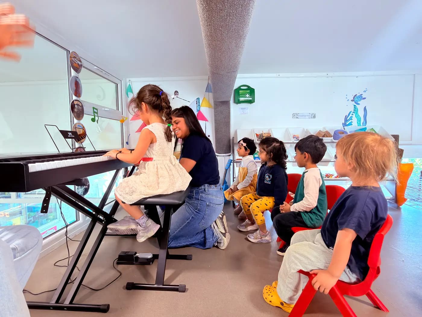 Children gathered for group circle time at Blue Nest Montessori Harrow
