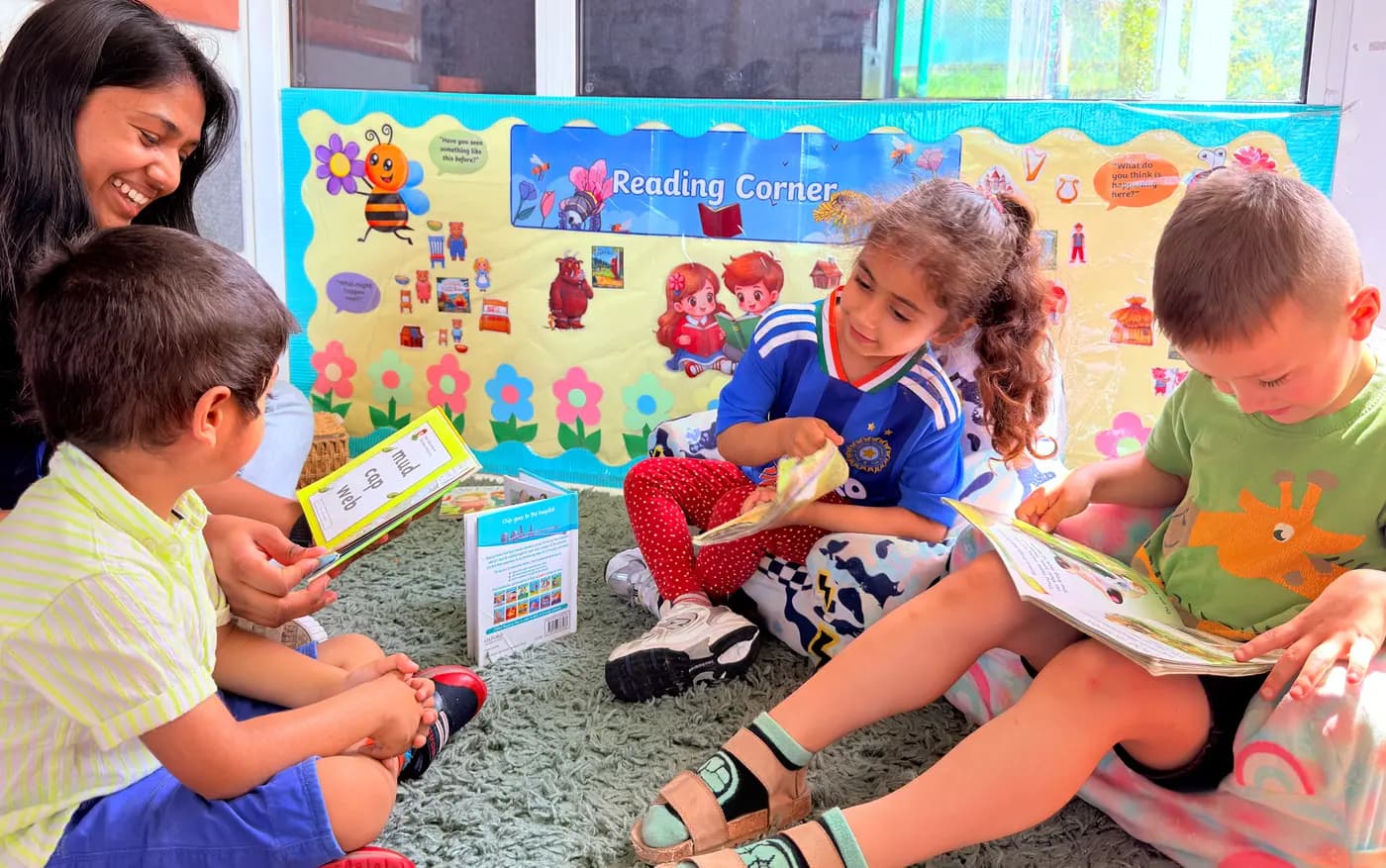 Children at a reading and letters activity at Blue Nest Pinner